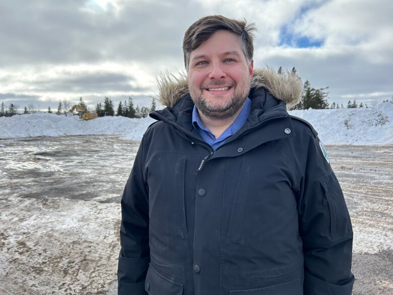 Man standing in field of snow.