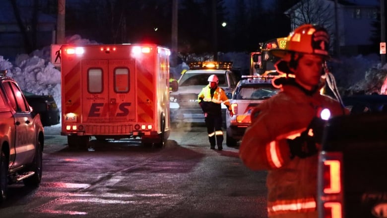 an EHS truck and a firefighter standing near it.