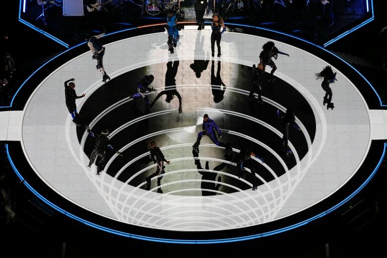 Performers on stage wearing roller skates