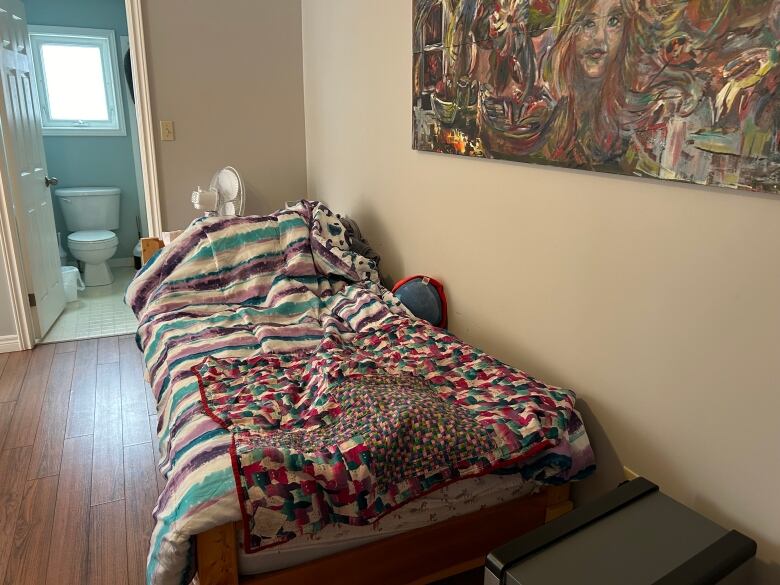 A bed in one of the rooms at Blooming House. 