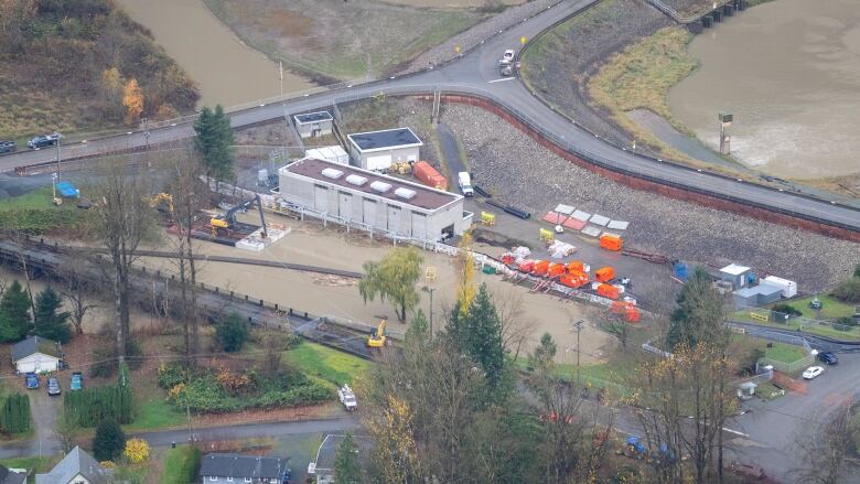 A pump station next to various bodies of water is pictured in an aerial shot.