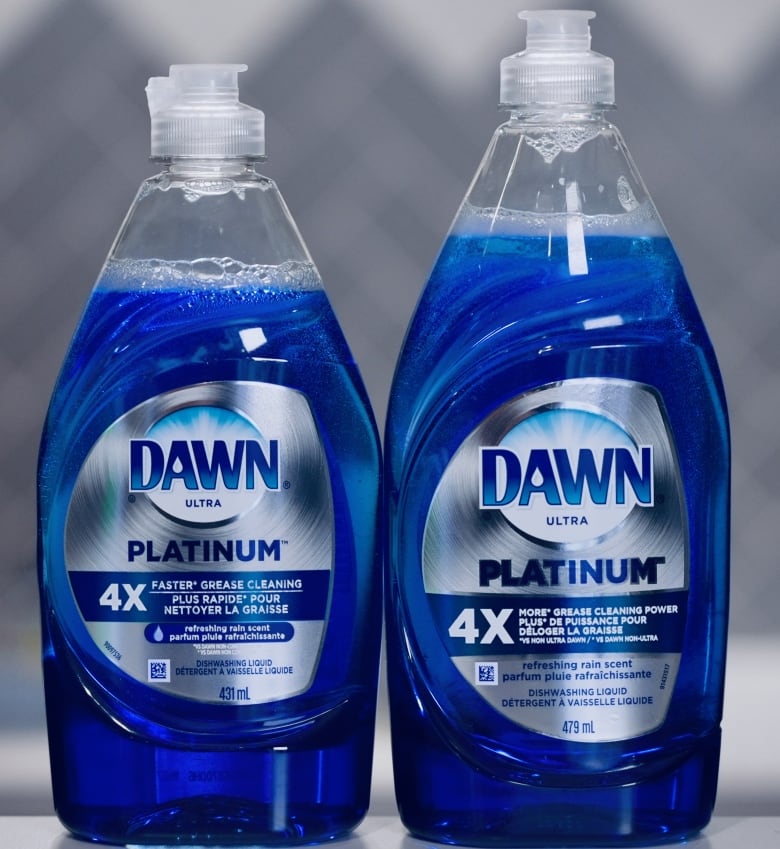 Two bottle of Dawn dishsoap sitting side by side. 