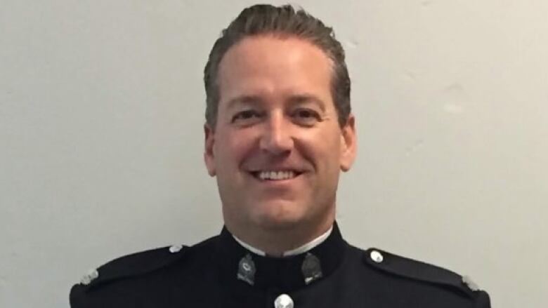 A white man is seen in his Victoria Police department uniform.