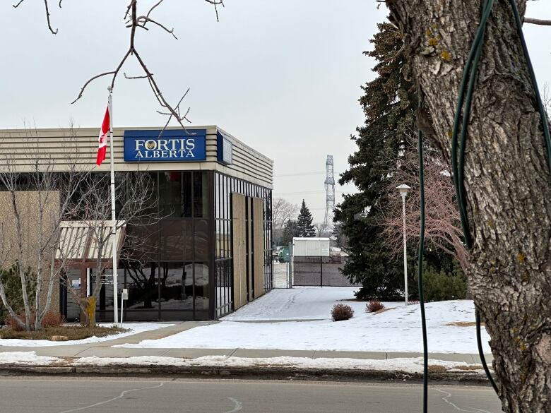 A sign on a building says Fortis Alberta.