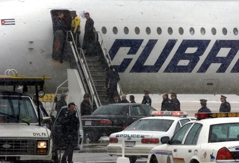 Jos Imperatori is seen climbing the stairs of a Cuban airliner at Ottawa's international airport on March 2, 2000.