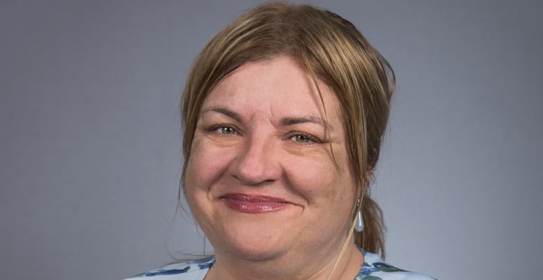 Woman looking at camera smiling