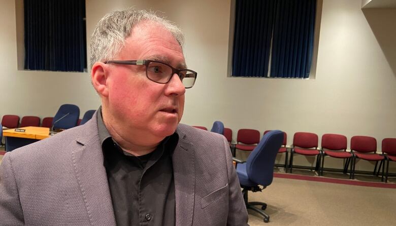 Ken Forrest speaks inside Fredericton council chambers.