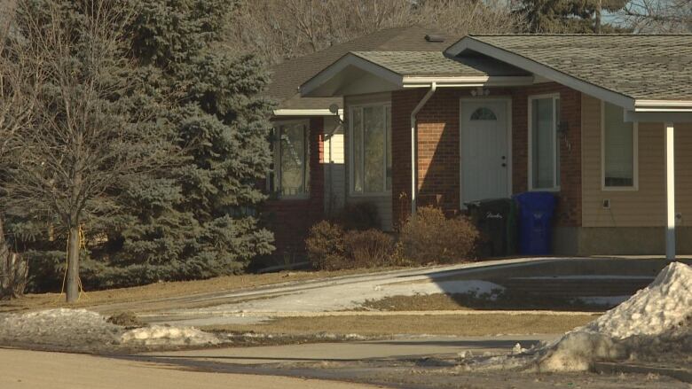 Lawns and homes with very little snow.