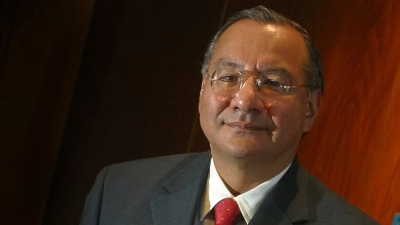 Victor Manuel Rocha is seen posing for a photo at a Miami office in January 2003.