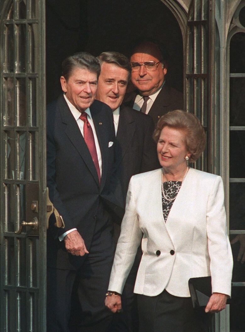 Economic Summit leaders (from left) Ronald Reagan, Brian Mulroney and Helmut Kohl follow Margaret Thatcher, into a courtyard at Hart House in Toronto, June 20, 1988.