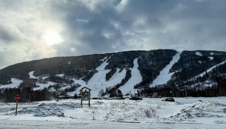 The ski hill is pictured in full with the slopes looking snowy.