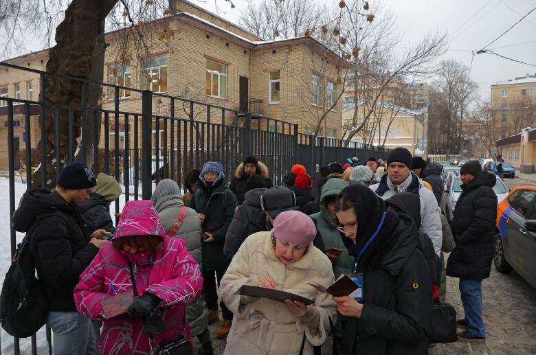 People put signatures in support of Boris Nadezhdin on January 23, 2024. He was later barred from running for president by Russia's election commission. 