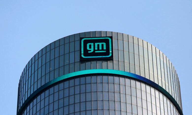 GM logo on a curved building with lots of window panes.