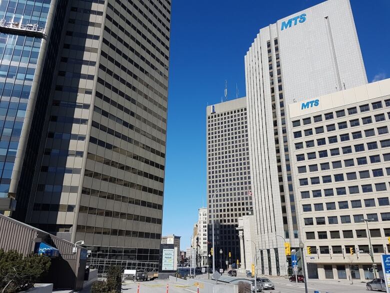 A cluster of tall buildings are seen in a downtown skyline.