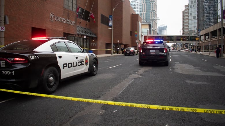 Police vehicles on the road.