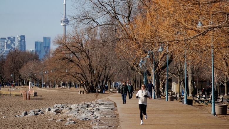 Torontonians enjoy an exceptionally warm day in the city.