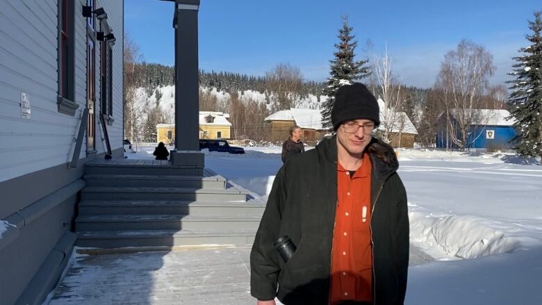 A man walking outside of a courthouse