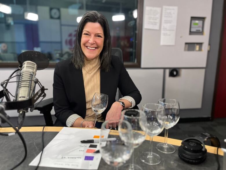 Marie-France Champagne, Sommelier and teacher at Algonquin College, takes a taste of Ottawa water samples. 