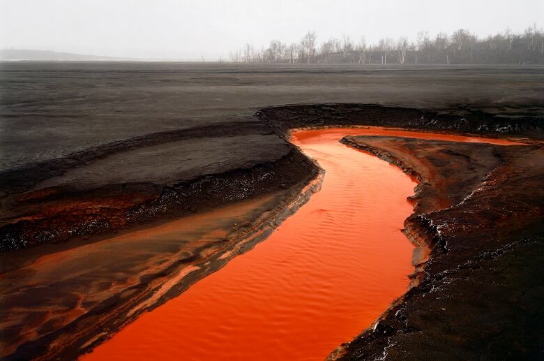 Captured by Burtynsky in 1996, this photograph shows the nickel tailings just outside of Sudbury, Ontario, one of the most mineral-rich areas in the world.