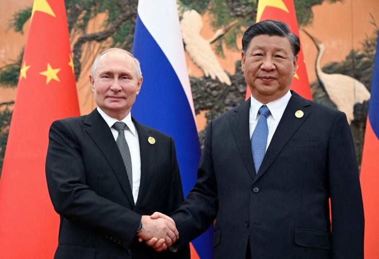 Russian President Vladimir Putin shakes hands with Chinese President Xi Jinping during a meeting at the Belt and Road Forum in Beijing, China, October 18, 2023. 