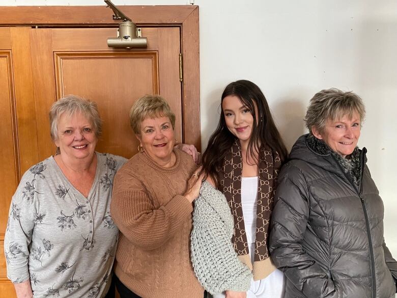 Four women smiling