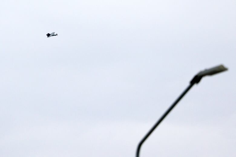 A drone is seen flying above Belgorod, Russia, on Thursday.