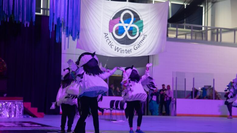 people in chickadee costumes dance at AWGs