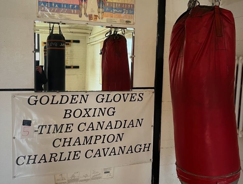 A sign next to a punching bag reads 