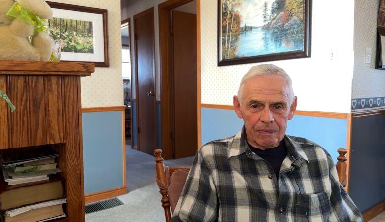 Merlin Trussler in his home. 