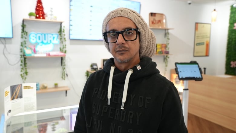 Photo of Shakir Tayabali inside a cannabis retail store