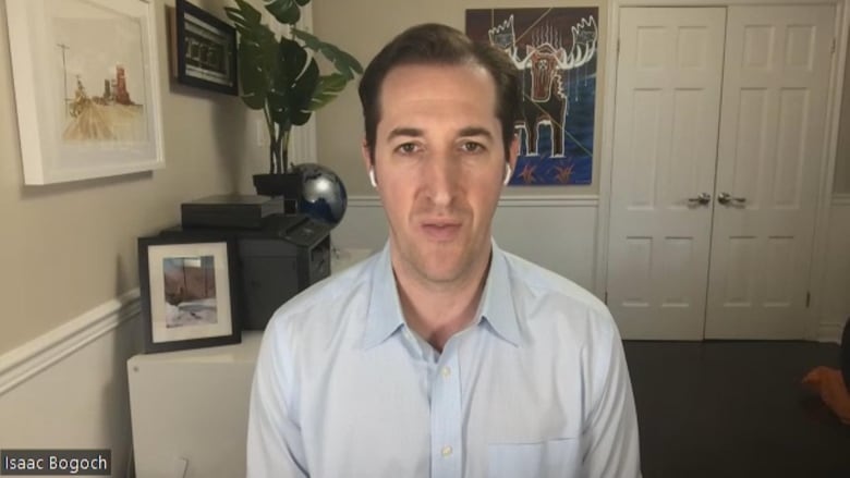 Screenshot from a Zoom call showing a man with short brown hair talking in a blue shirt.