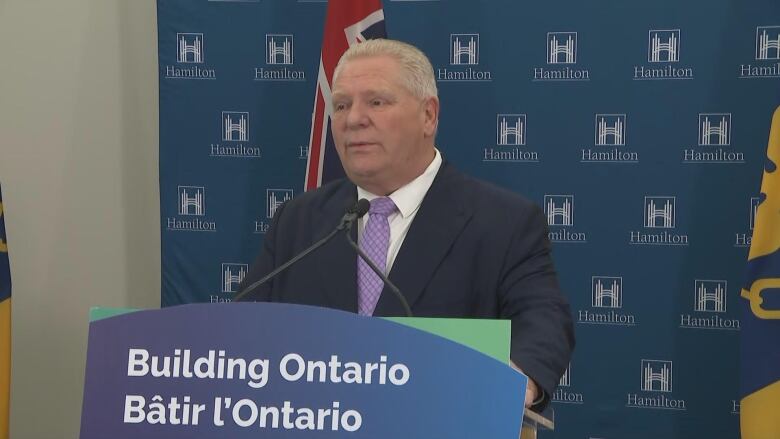 A man stands at a podium.