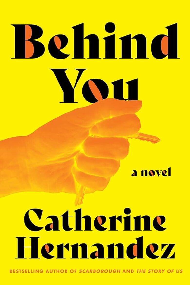 A yellow book cover with an orange hand holding keys between its fingers. 