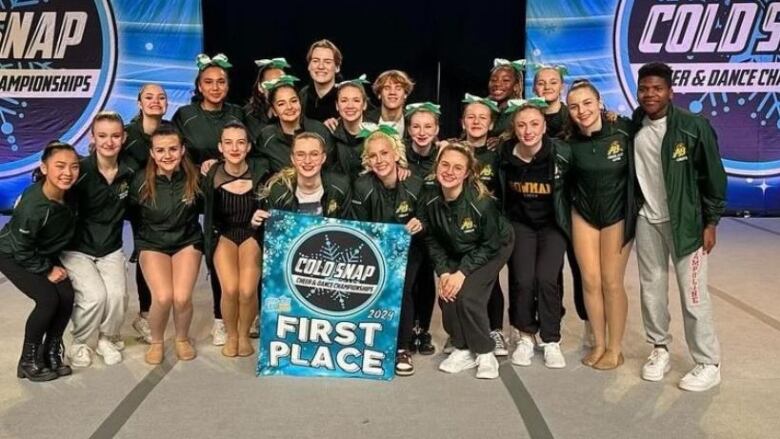 Saskatoon's Aden Bowman Collegiate cheer and dance team can't defend their city title after Tuesday's competition was canceled dur to an ongoing contract dispute between Saskatchewan teachers and the govenrment. Captain Liva Sondergaard (front row, hands clasped) said they're disappointed.