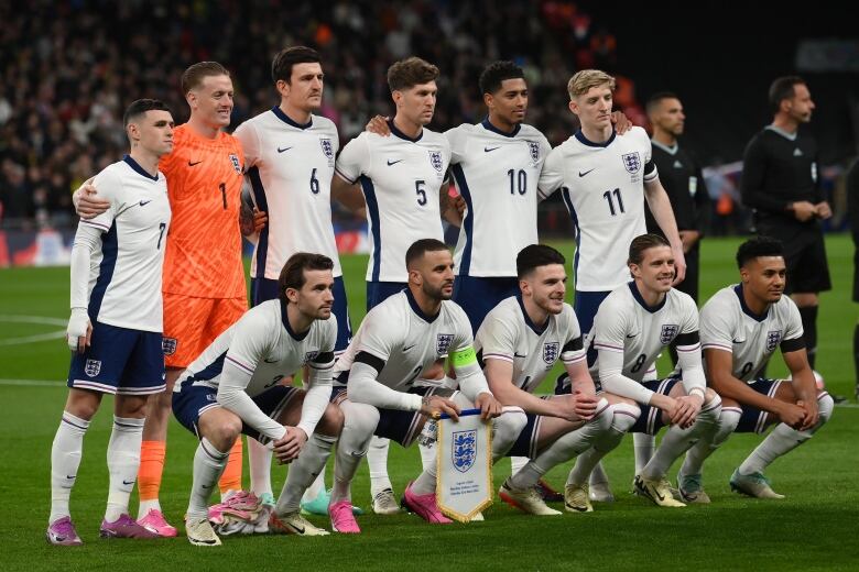 A soccer team poses for a photo.