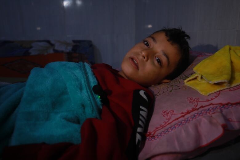 Yahya in a Rafah hospital in the aftermath of the Israeli air strike that killed his entire family.