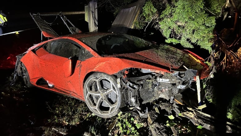 A destroyed Lamborghini in a ditch.