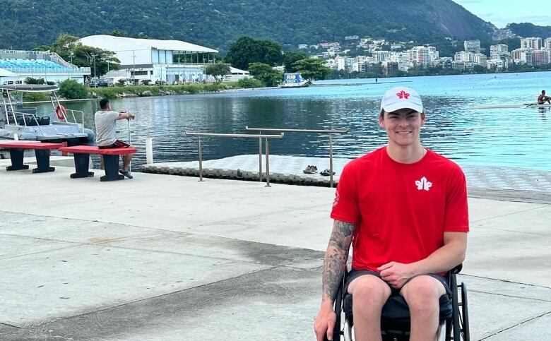 A Para athlete smiles while seated in his wheelchair.