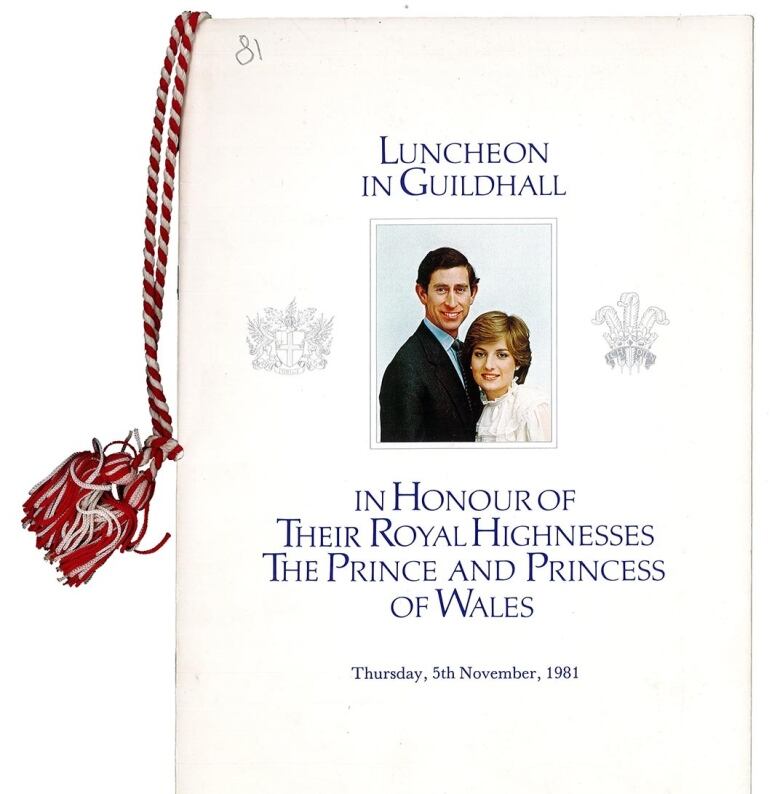 A white menu booklet with a red and white striped string on the left. Pictured are a man and a woman. 