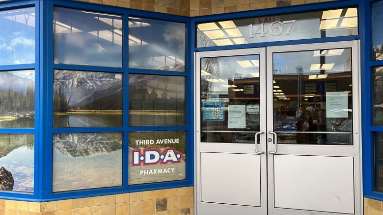 The front of a pharmacy, with text reading 'Third Avenue IDA Pharmacy'.