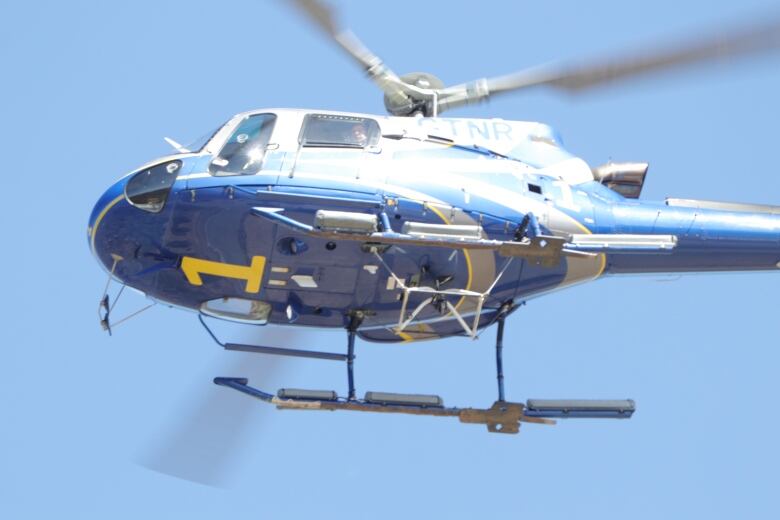 A close up shot of a helicopter is shown.