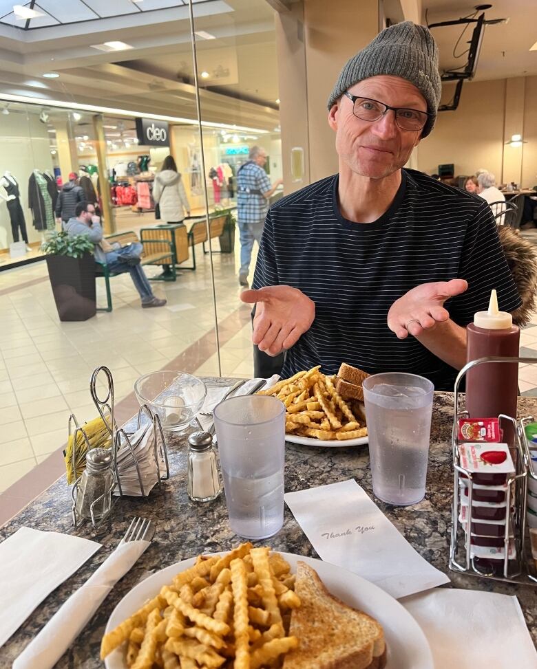 Saskatoon Morning's Danny Kerslake enjoys a grilled cheese sandwhich at Coachman Restaurant and Bar. 