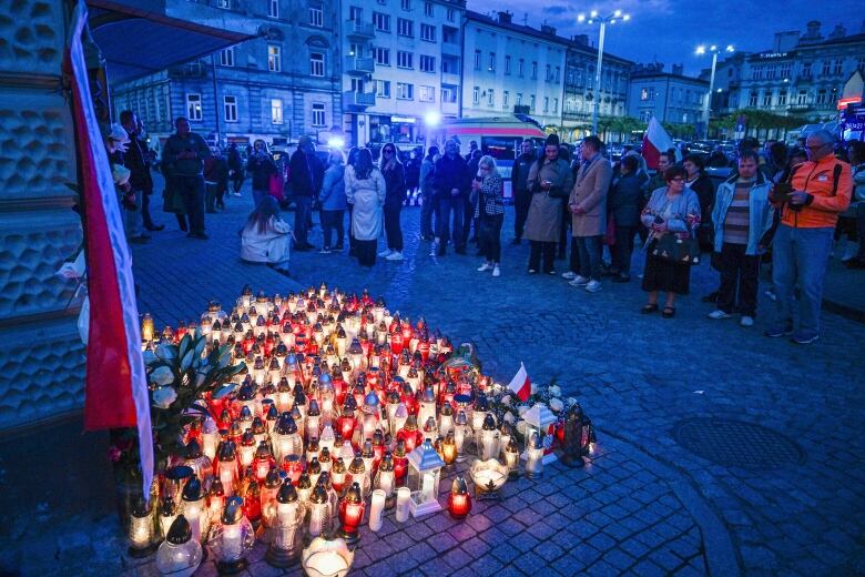 Friends and residents gather to place candles and flowers in honor of Damian Sobl, a Polish food aid worker who was killed with six other World Central Kirchen workers by Israeli airstrike in Gaza this week, in Sobl's hometown of Przemysl, in southeastern Poland, on Thursday, April 4, 2024. World Central Kitchen and a few other aid groups suspended operations in Gaza, after seven aid workers were killed by airstrikes. Yet despite the danger, many of the largest organizations barely slowed down. Hunger has become commonplace in Gaza amid the war with Israel, and U.N. officials warn that famine is increasingly likely in northern Gaza.