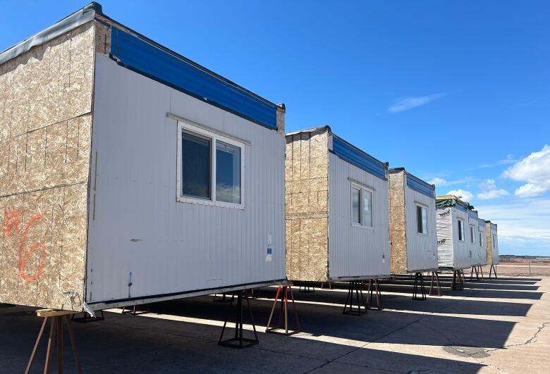 Modular building units are standing on pylons as they wait to be converted into a shelter complex in Summerside