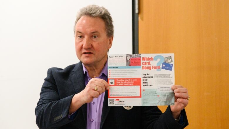 Peter Bergmanis, co-chair of the London Health Coalition, speaks at a news conference in downtown London, Ont. on April 16, 2024