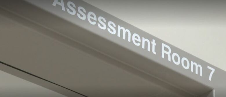 Assessment Room 7 sign.