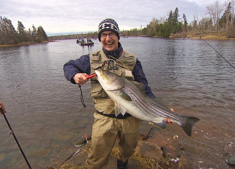 Man holding large fish.