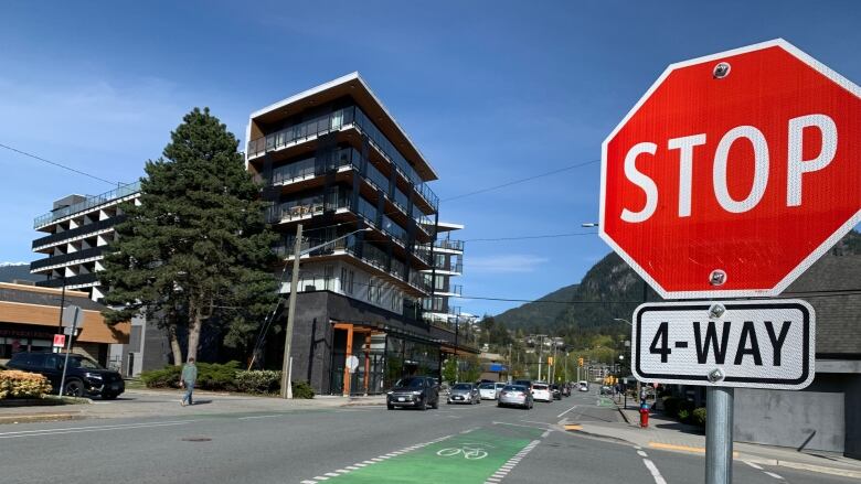 An intersection in a city with a stop sign visible.