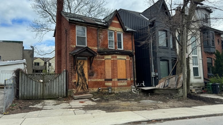 A boarded up home. 