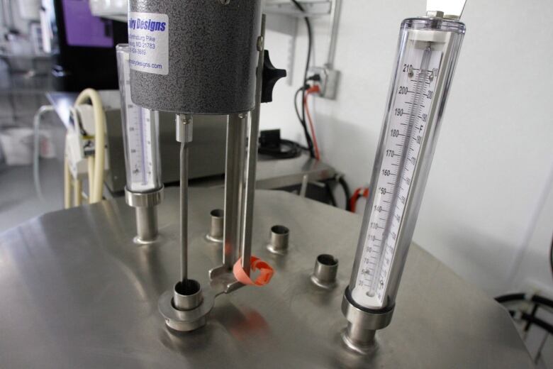 Thermometers are seen atop a small-scale pasteurizer in Plainfield, Vt.